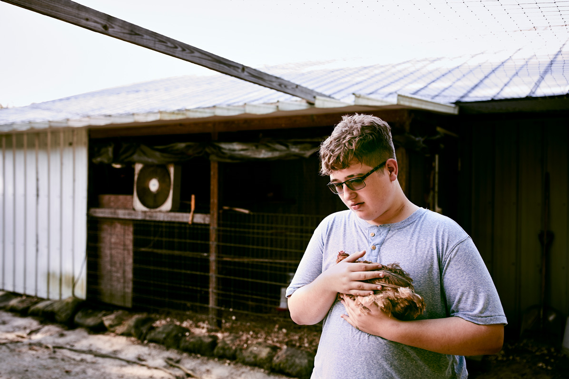 Boy Holding Chicken