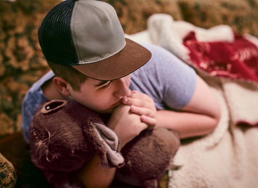 Boy Holding Stuffed Animal