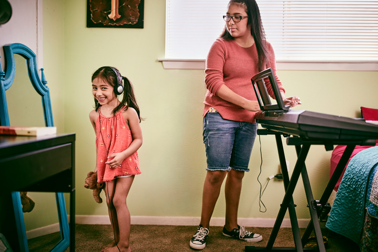Two Girls Playing Piano