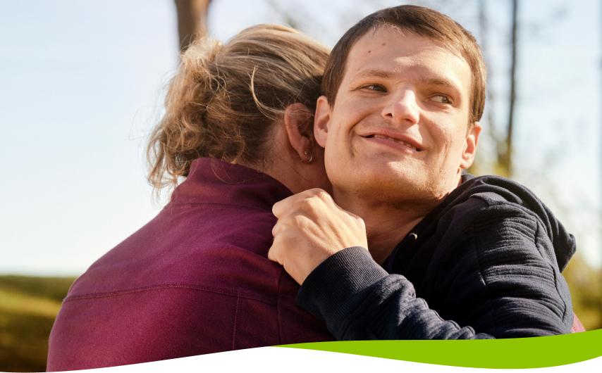 An embrace between Steven, living with LGS, and his mother